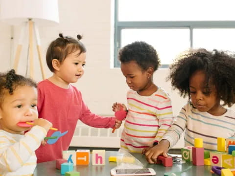 a group of children playing with toys