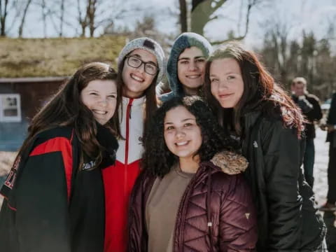 a group of people posing for a photo