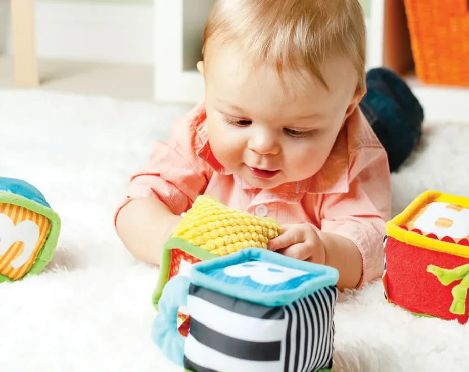 a baby playing with a toy