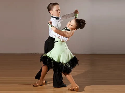 a man and woman dancing