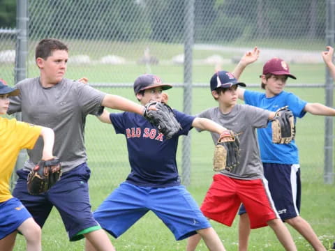 a group of kids playing baseball