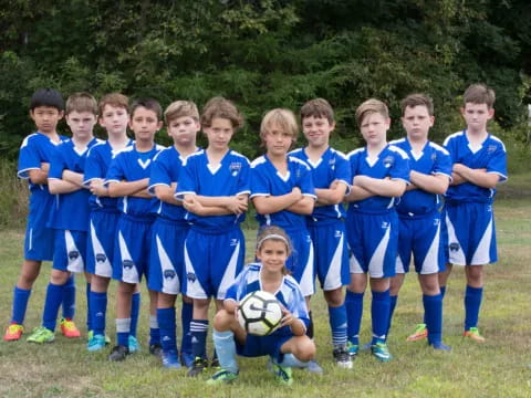 a group of kids in football uniforms