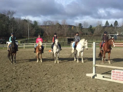 a group of people riding horses