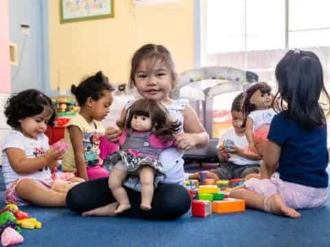 a group of children sitting on the floor