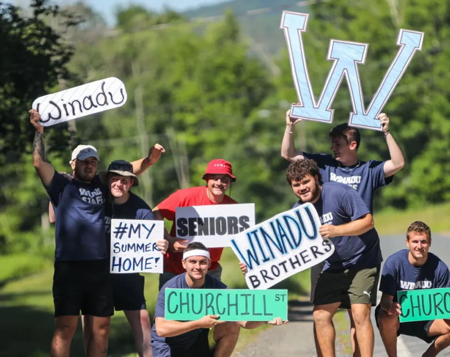 a group of people holding signs