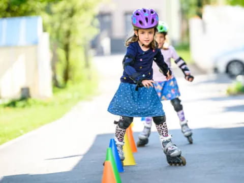 a couple of girls rollerblading