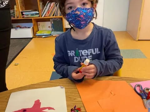 a boy with a mask on his face