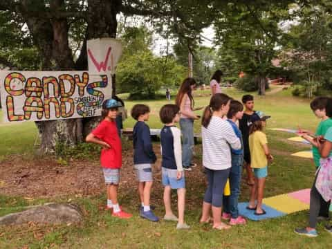 a group of children standing in a park