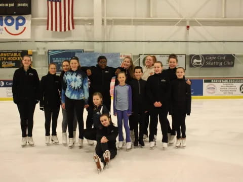 a group of people posing for a photo on ice