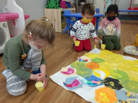 children painting on a table