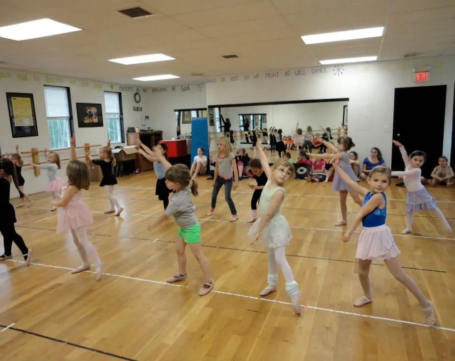 a group of girls dancing in a gym