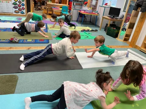 a group of children doing yoga