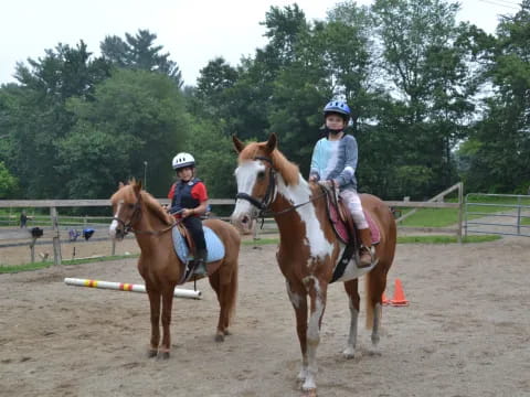 a group of people riding horses