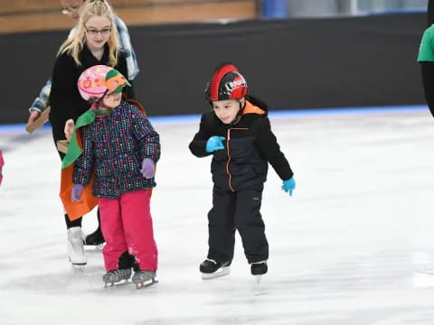 a group of children ice skating
