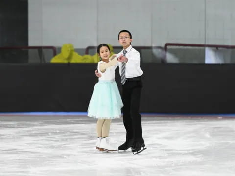 a person and a girl on ice