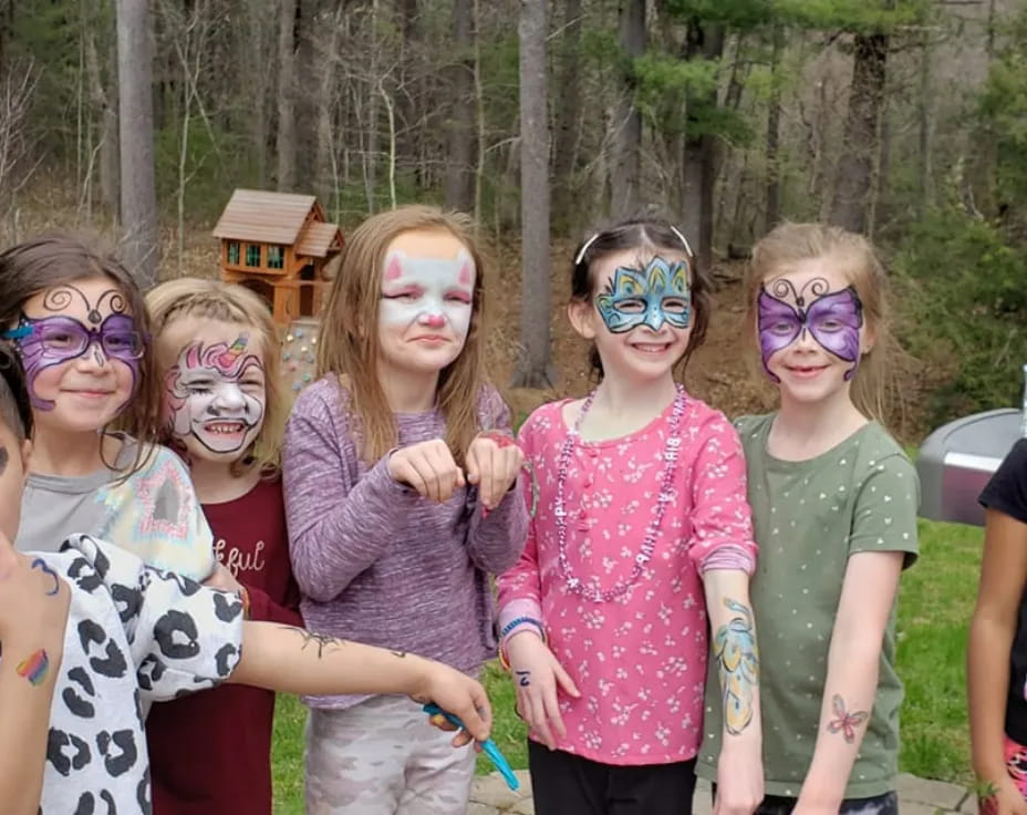 a group of children with paint on their faces