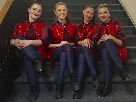 a group of people sitting on stairs