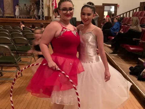 two women in dresses