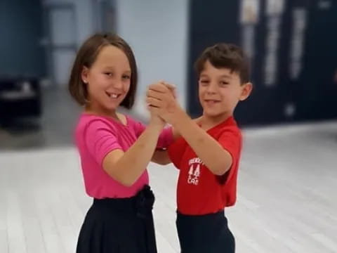 a boy and girl posing for a picture