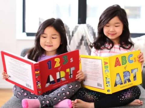 a couple of girls reading books