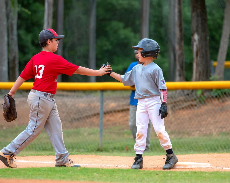 a couple of kids playing baseball