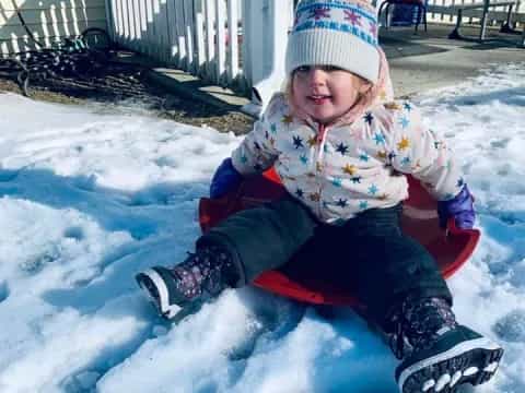 a child sitting in the snow