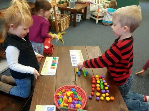 a group of children playing with toys