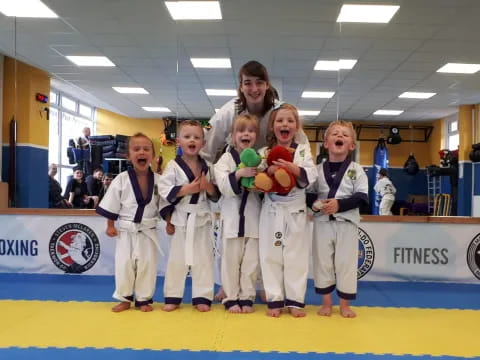 a group of people in karate uniforms