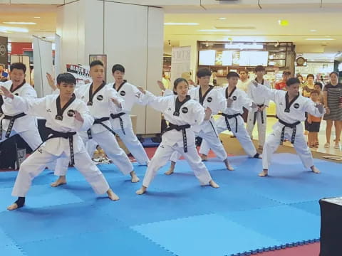 a group of people in karate uniforms