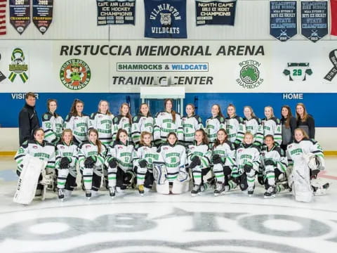 a group of people posing for a photo on ice