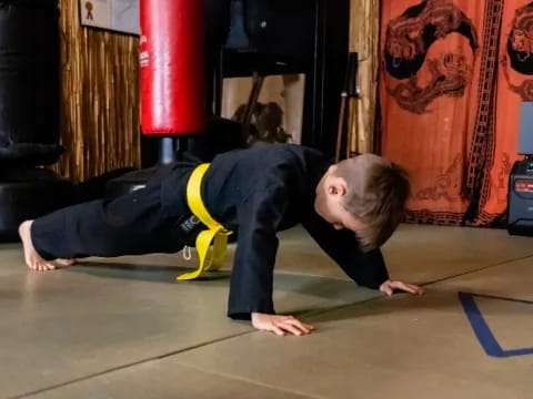 a person doing a plank on the floor