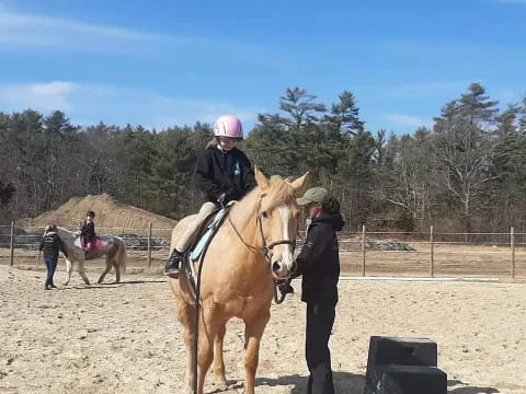 a girl riding a horse