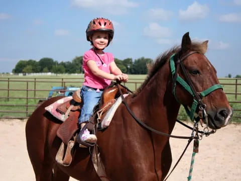 a girl riding a horse