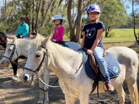 a group of people riding horses