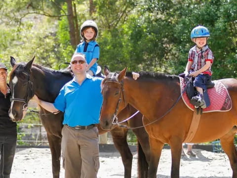 a group of people with horses