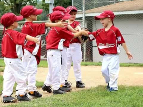 a group of kids in red uniforms