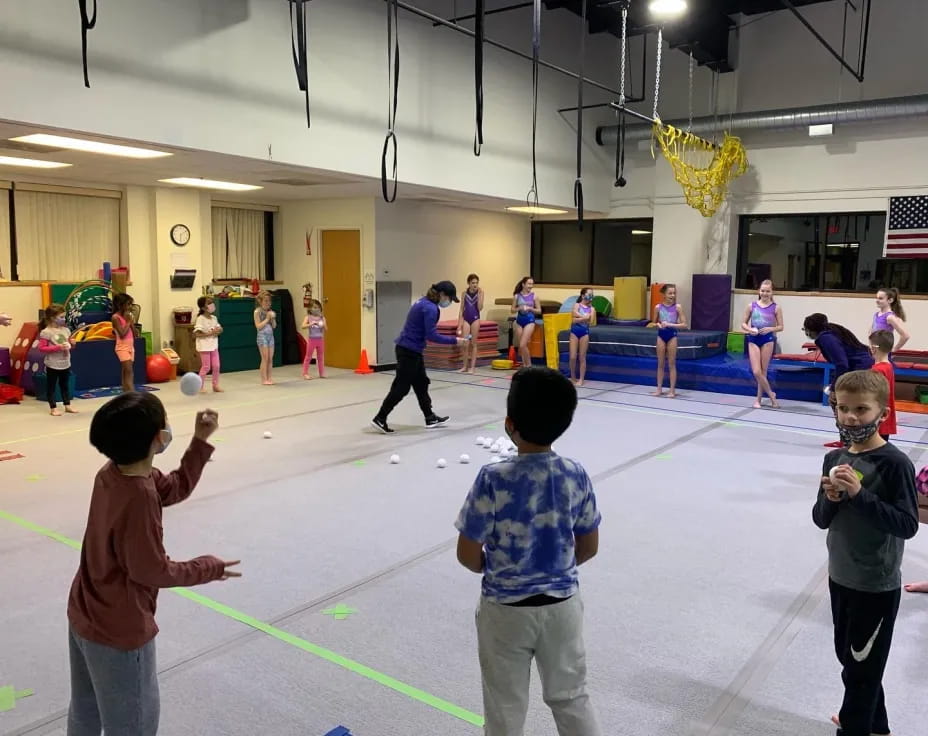 a group of children playing in a gymnasium