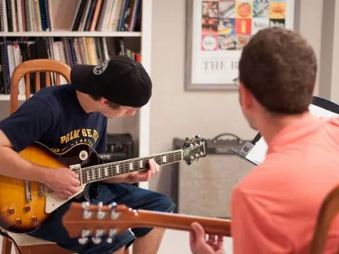 a man playing a guitar