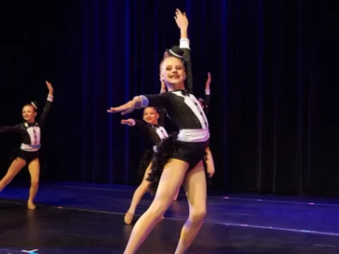 a group of women dancing on a stage