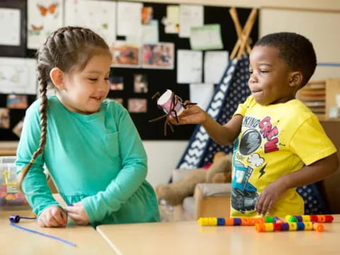 a couple of children playing with toys