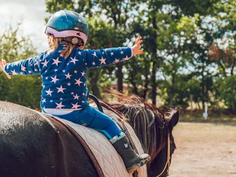 a girl riding a horse