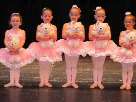 a group of girls in dresses