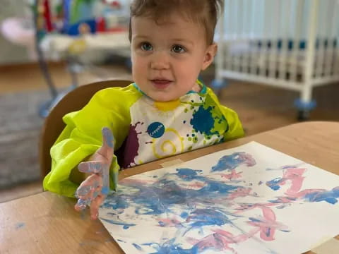 a child sitting at a table