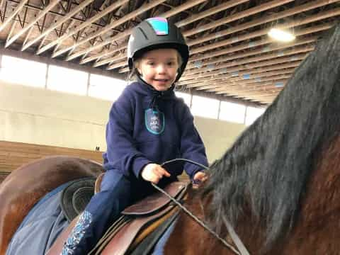 a girl riding a horse