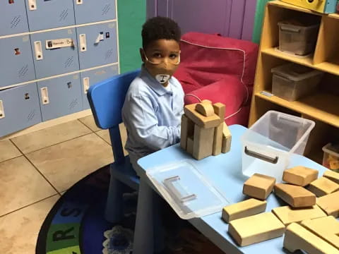 a boy sitting at a table