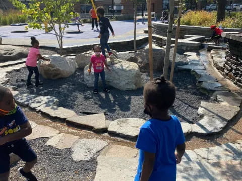 a group of children playing in a park