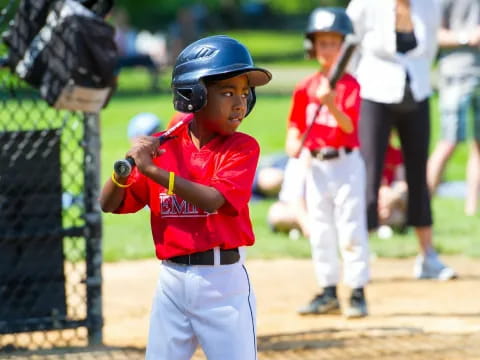 a young boy playing baseball