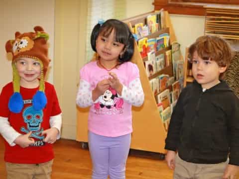 a group of kids wearing clothing