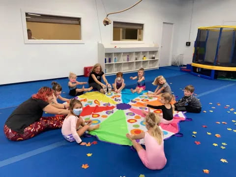 a group of people sitting on the floor