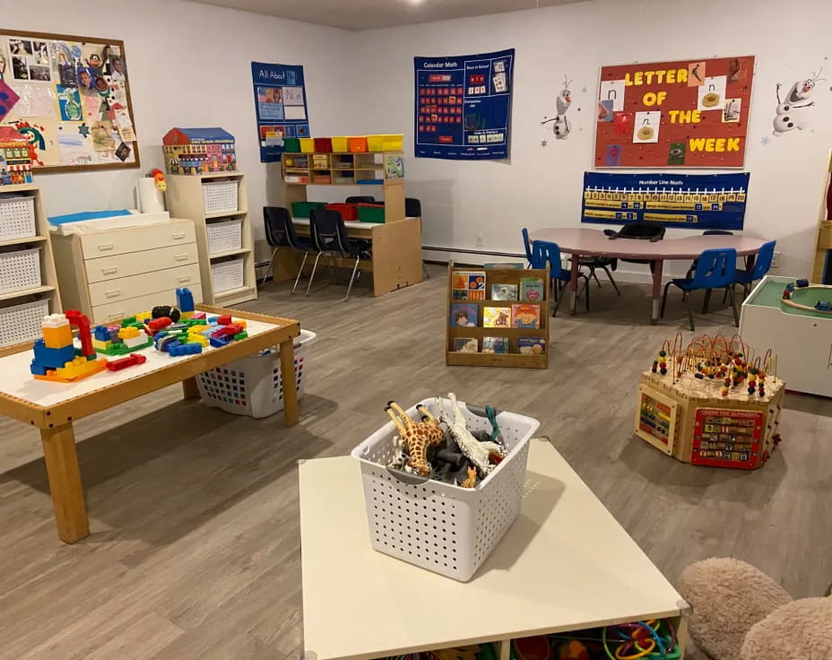 a room with tables and toys